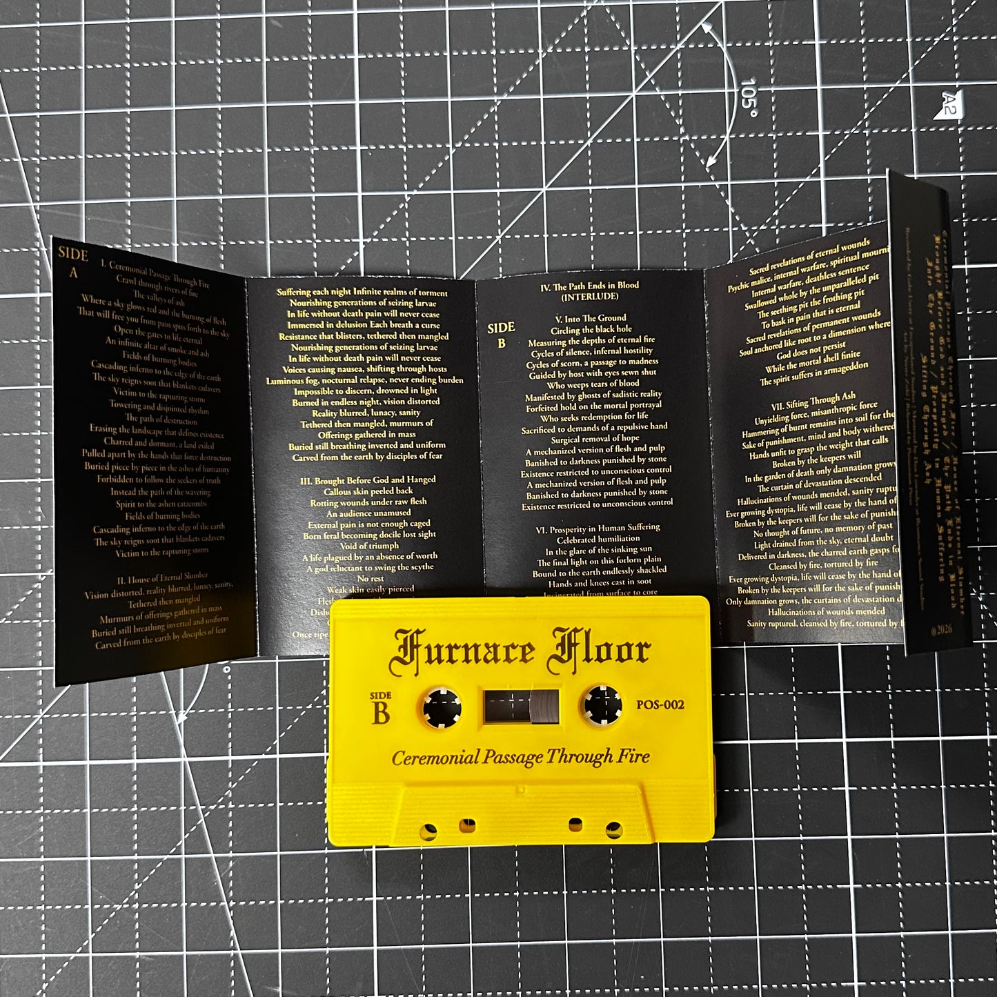 Yellow cassette tape with 'Furnace Floor' on a black and white grid background