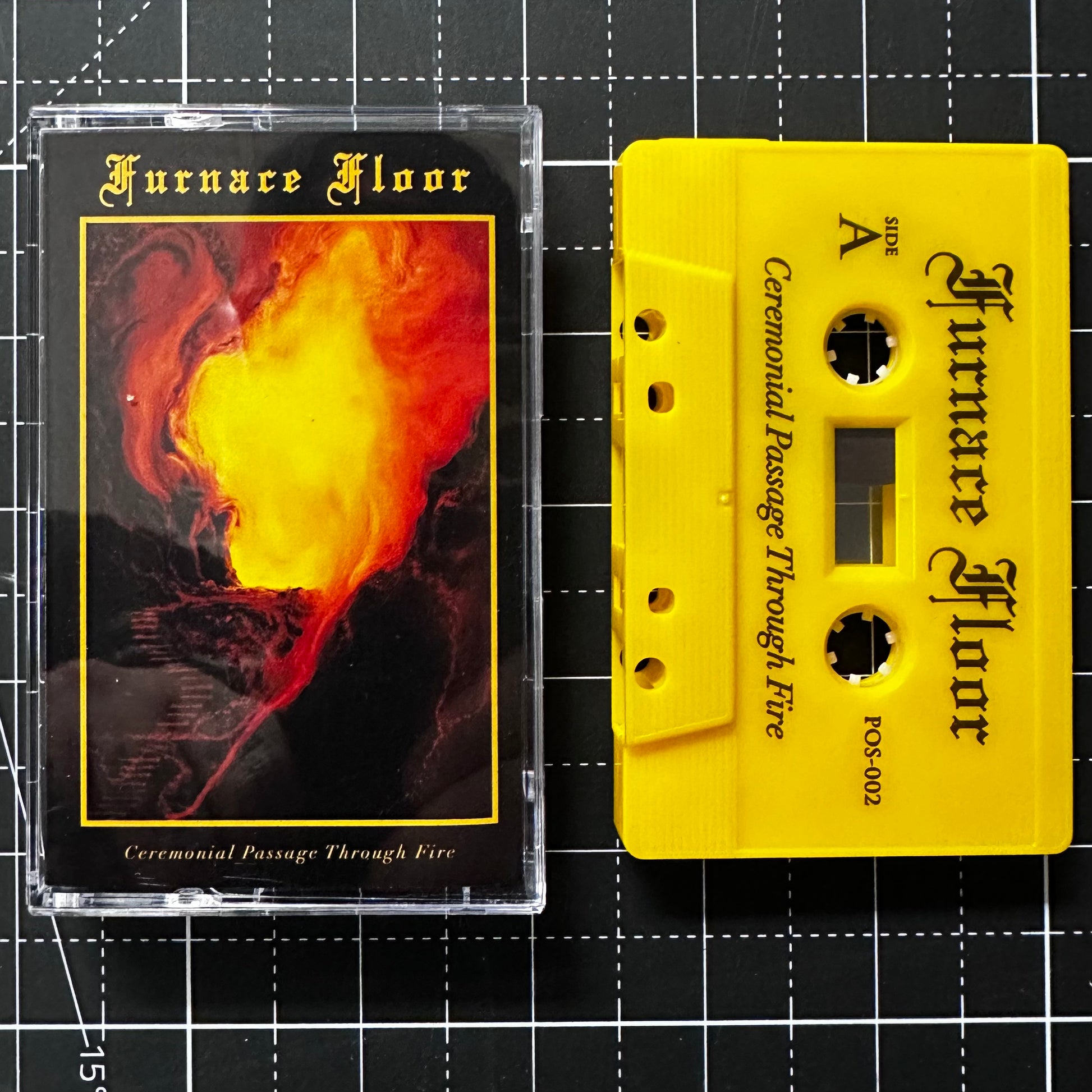 Cassette tape and its cover of 'Furnace Floor' on a grid background