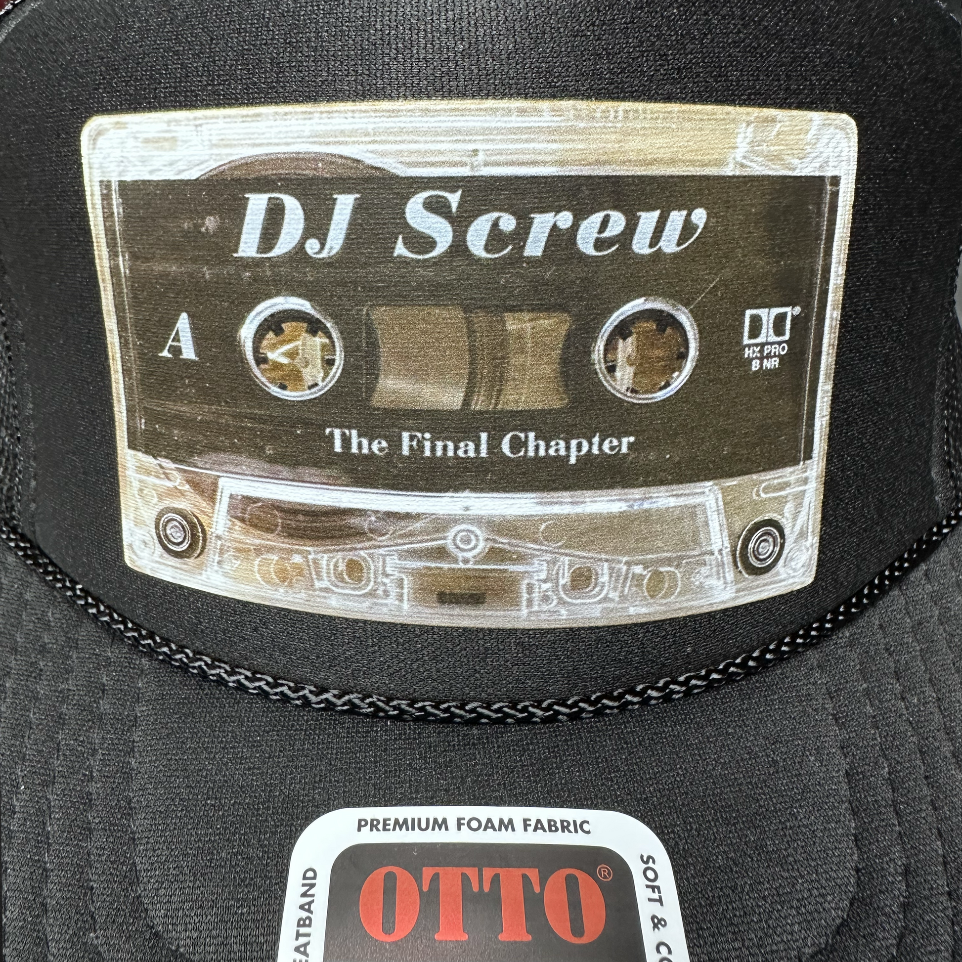 Black cap with a cassette tape design and 'DJ Screw' text, featuring the brand 'OTTO'.